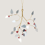 Branch in iron and brass with red beads ornament