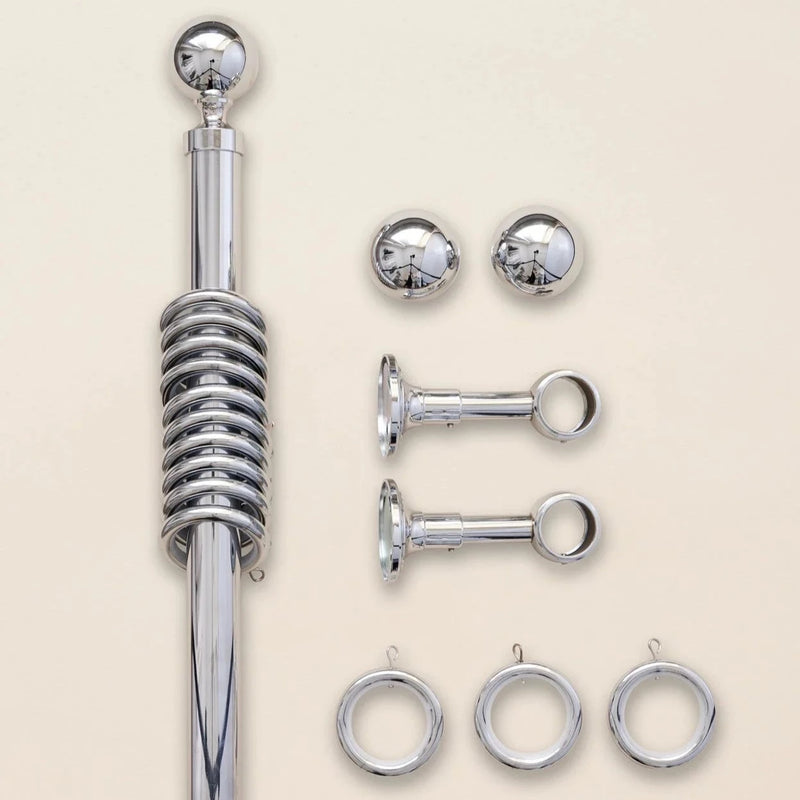 Metal curtain pole and rings in chrome
