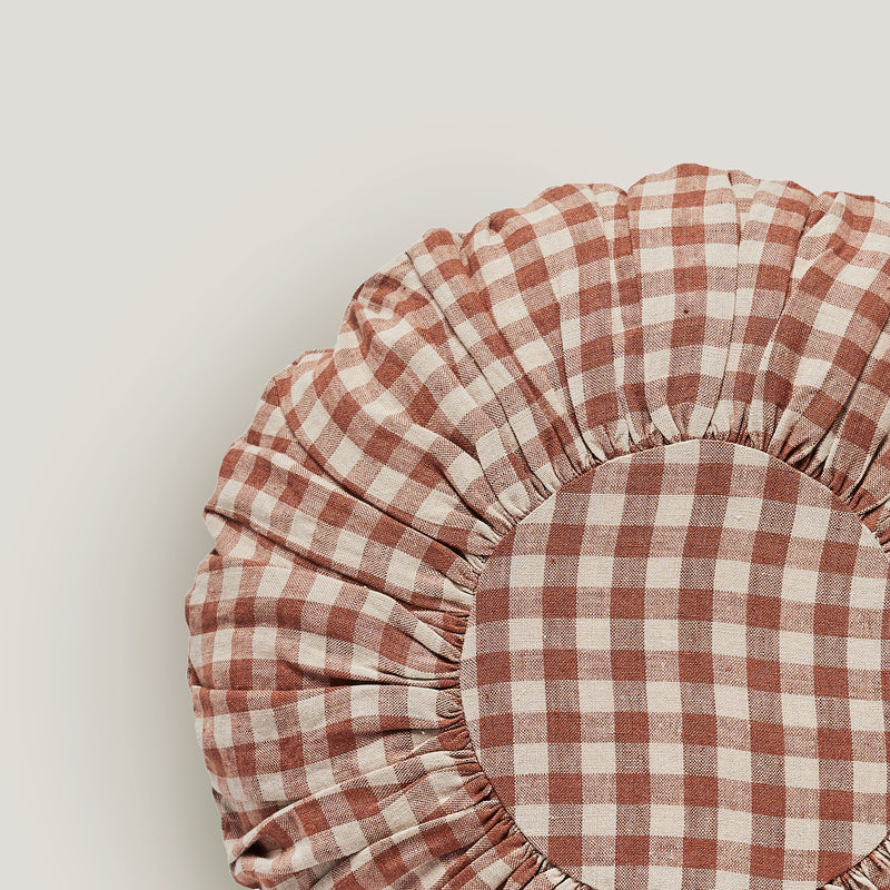 Wes gingham blush round cushion
