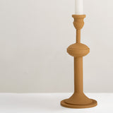 Indica yellow metal candlestick holder