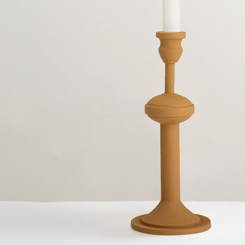 Indica yellow metal candlestick holder