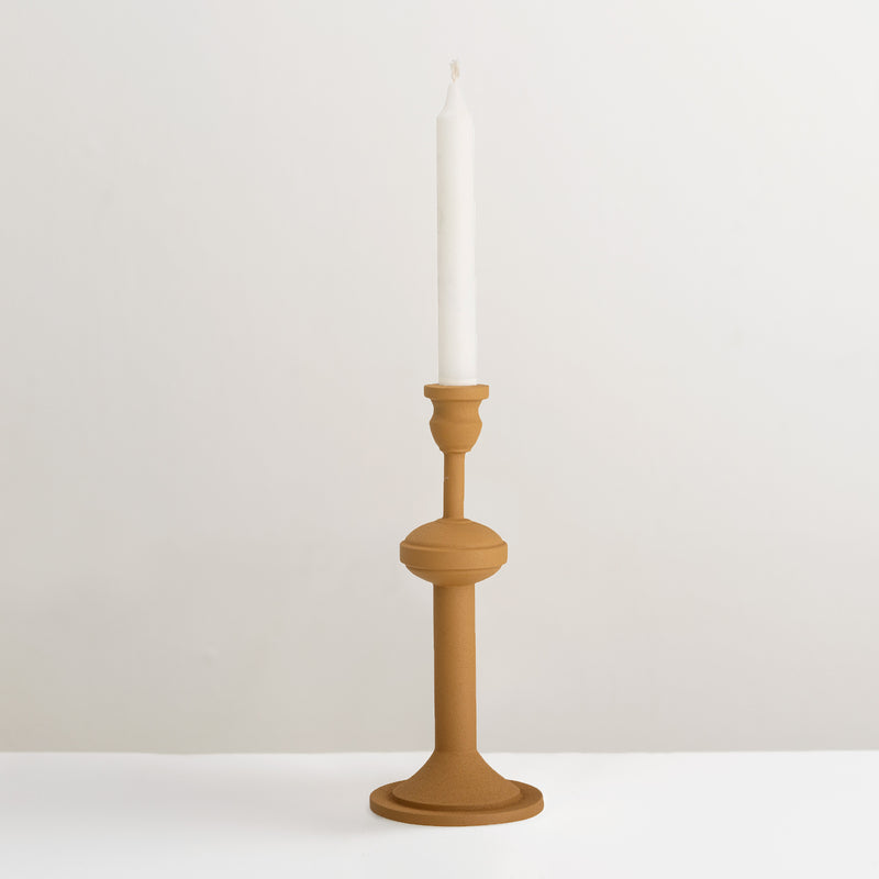 Indica yellow metal candlestick holder
